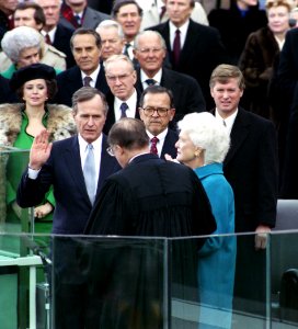 Vice President George Herbert Walker Bush takes the Oath of Office and becomes the 41st President of the United States