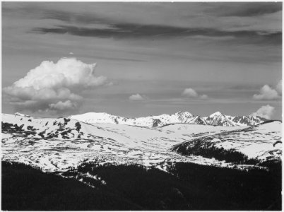 View at timberline, dark foreground, light snow capped mountain, gray sky, Rocky Mountain National Park. Never Summer R - NARA - 519960