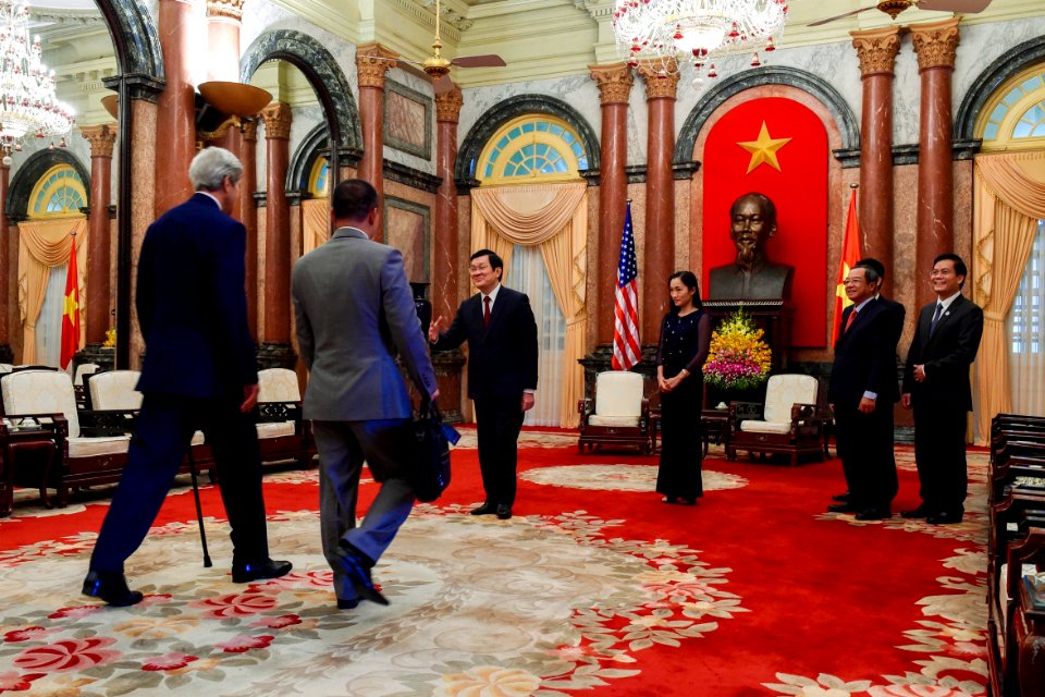 Vietnamese President Sang Greets Secretary Kerry as he Arrives at the Presidential Palace of Vietnam in Hanoi