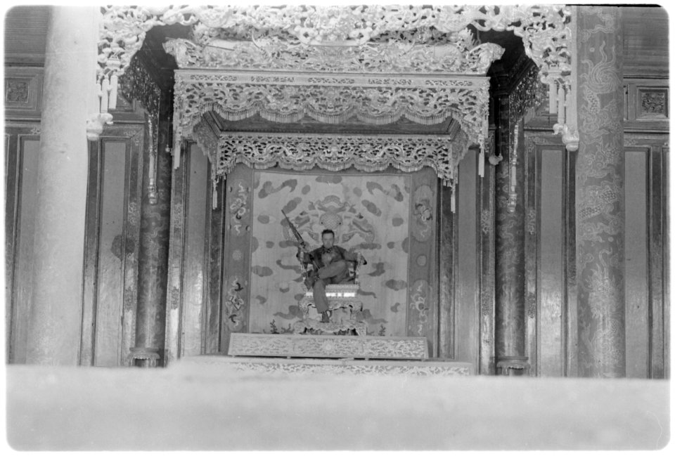 Vietnam....Sergeant P.L. Thompson sits on a throne in the palace in the old city of Hue. - NARA - 532504