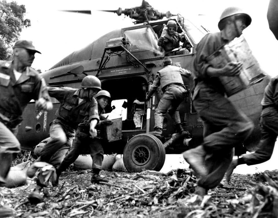 Vietnamese soldiers unload supplies from a U.S. Marine Corps Sikorsky UH-34D, 1964 (USIA 64-1238)