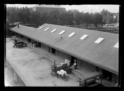View East (4th Street) side of Baltimore & Potomac Railroad Co. Freight house between 4th & 6th, C & D, Virginia Avenue, showing man loading freight into horse-drawn cart LCCN2016647118