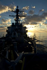 View facing bow of USS Carney (DDG-64) during sunrise in Mediterranean 151209-N-FP878-374