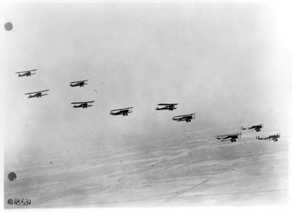 View from airplane of biplanes flying in formation- Side view of airplanes LCCN2002699750