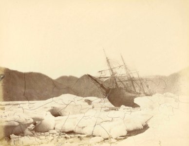 View from the ice of 'Alert' (1856) ashore in Radmore Harbour, Rawlings Bay, at low tide. RMG B3669-G photo