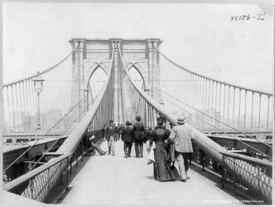 View looking across the Brooklyn Bridge, N.Y.C. with people walking in both directions LCCN2006681264