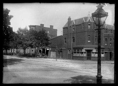 View of 1st Street, N.W., East side, looking North from D Street showing Sing Kee's laundry on the corner LCCN2016646820