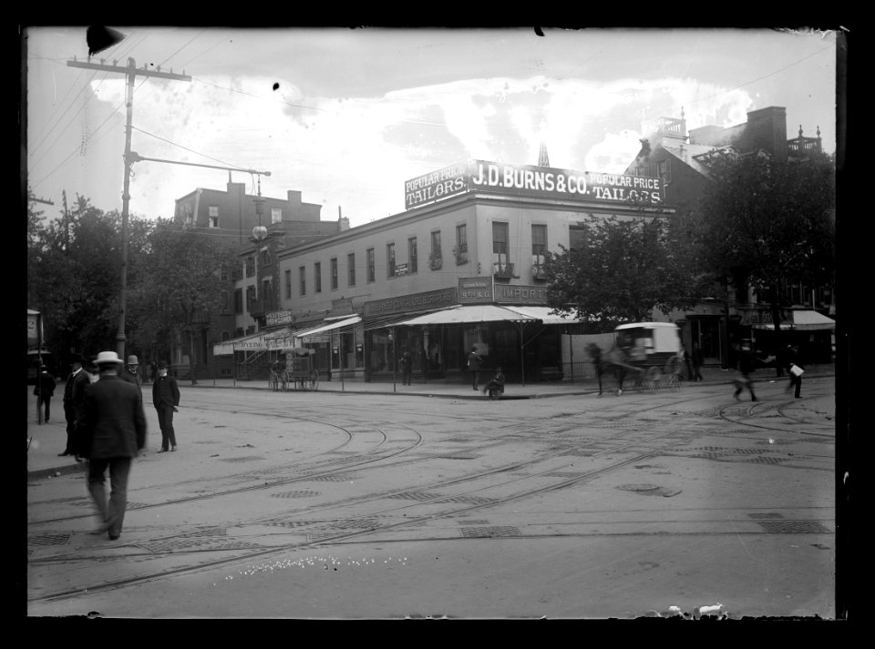 View of 9th Street, N.W., East side, looking North from G Street showing tailor shop J.D. Burns & Co. on the corner LCCN2016646853
