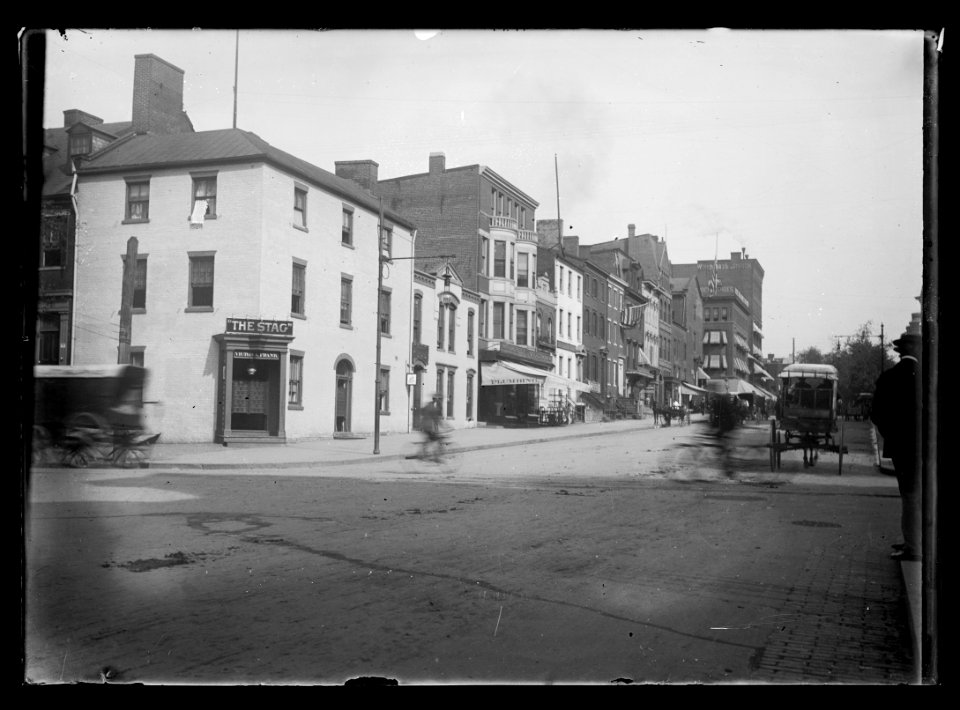 View of 10th Street, N.W., West side, looking North from E Street showing The Stag in the foreground on the corner and Woodward & Lothrop at the opposite end of the block LCCN2016646893