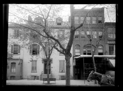 View of 12th Street, N.W., West side, between F & G streets with a front view of an office building, boarding house, and furniture repair shop LCCN2016646808