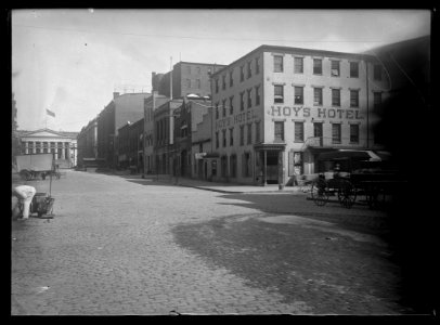 View of 8th Street, N.W., East side, looking North from D Street with Hoy's Hotel on the corner and the Patent Building at the end of the street LCCN2016646874