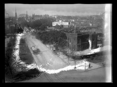 View of C Street, N.W., North side, looking West from New Jersey Avenue showing Cosmopolitan Hotel on the corner and in the distance is the flour mill of W.M. Galt & Co. LCCN2016646852 photo