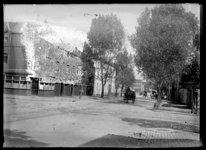 View of D Street, N.W., North side, looking East from 1st Street to North Capitol showing Sing Kee's laundry on the corner and further down the block obscured by trees the Golden Eagle Hotel LCCN2016646821