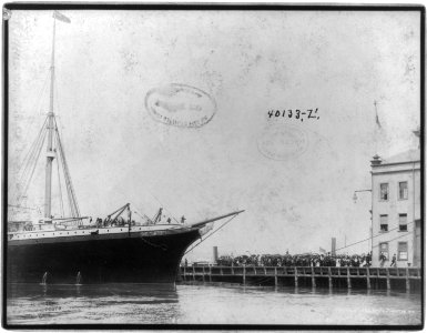View of bow of NEW YORK and crowd on wharf, New York City LCCN2004665478