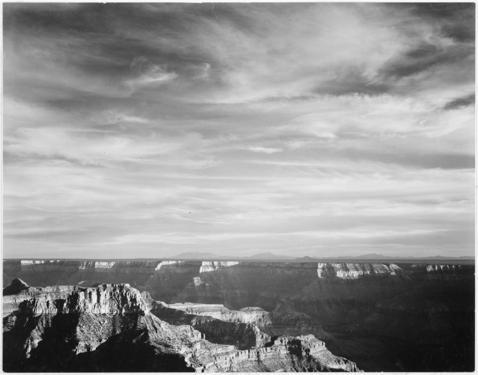 View of canyon in foreground, horizon, mountains and clouded sky, from North Rim, 1941,  Grand Canyon National Park, - NARA - 519890