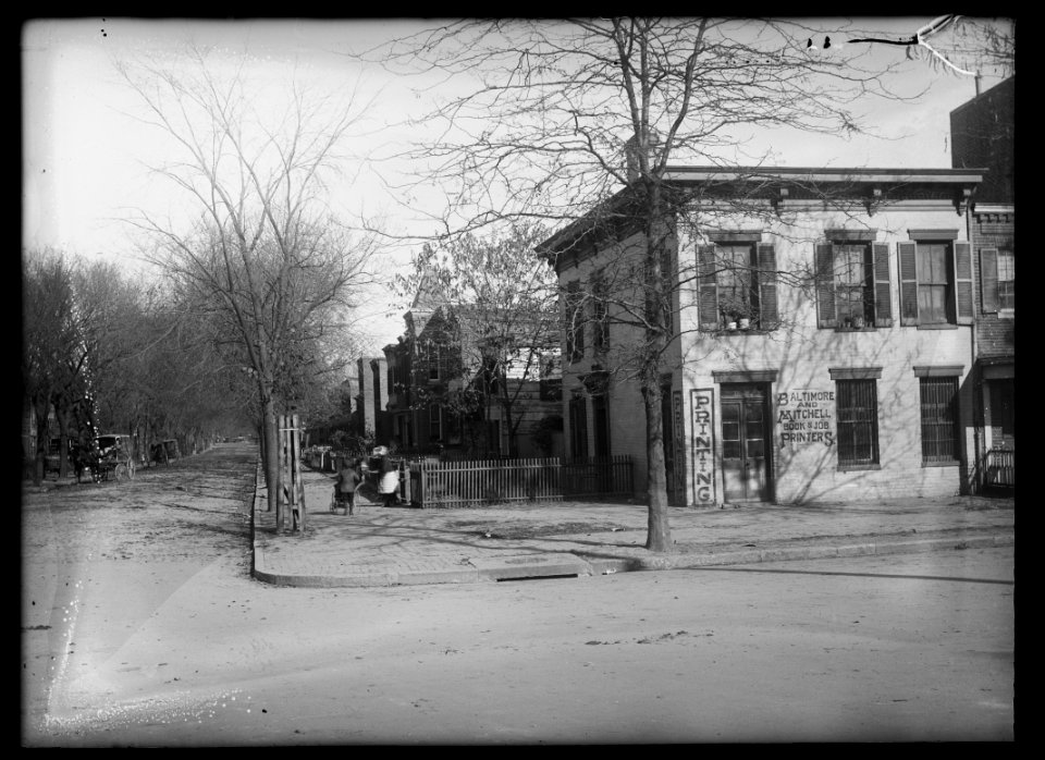 View of E Street, S.W., looking North up 1st Street showing Baltimore and Mitchell Book & Job Printers on the corner LCCN2016647117