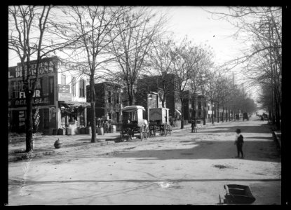 View of E Street, S.W., North side, looking East from Delaware Avenue, showing a grocery store on the corner LCCN2016647106 photo