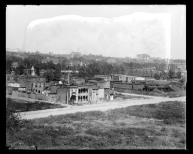 View of H Street, S.W., between Half & 1st Streets, in 1901 showing old homes near railroad station LCCN2016647111