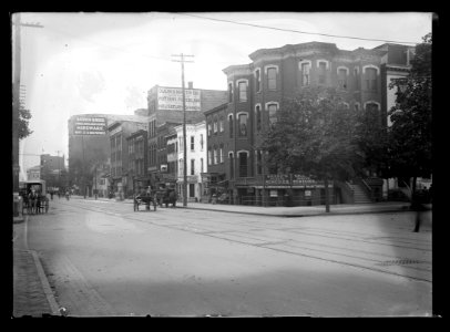 View of G Street, N.W., South side, looking East from 13th Street showing various businesses LCCN2016646866 photo