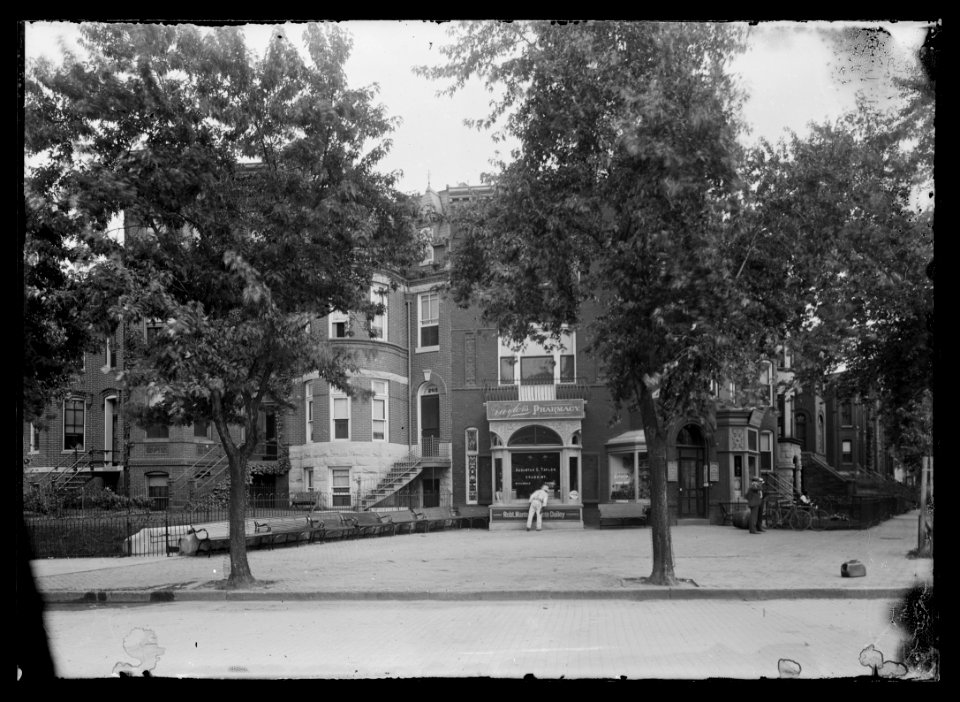 View of Maryland Avenue at 2nd Street, N.E., showing a man looking into the window of Taylor's Pharmacy LCCN2004665564