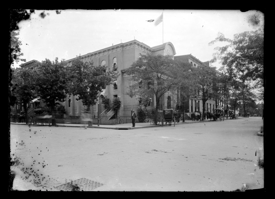 View of man standing on corner of D Street, N.W., North side, looking East from 6th Street (East side shown) LCCN2016646856