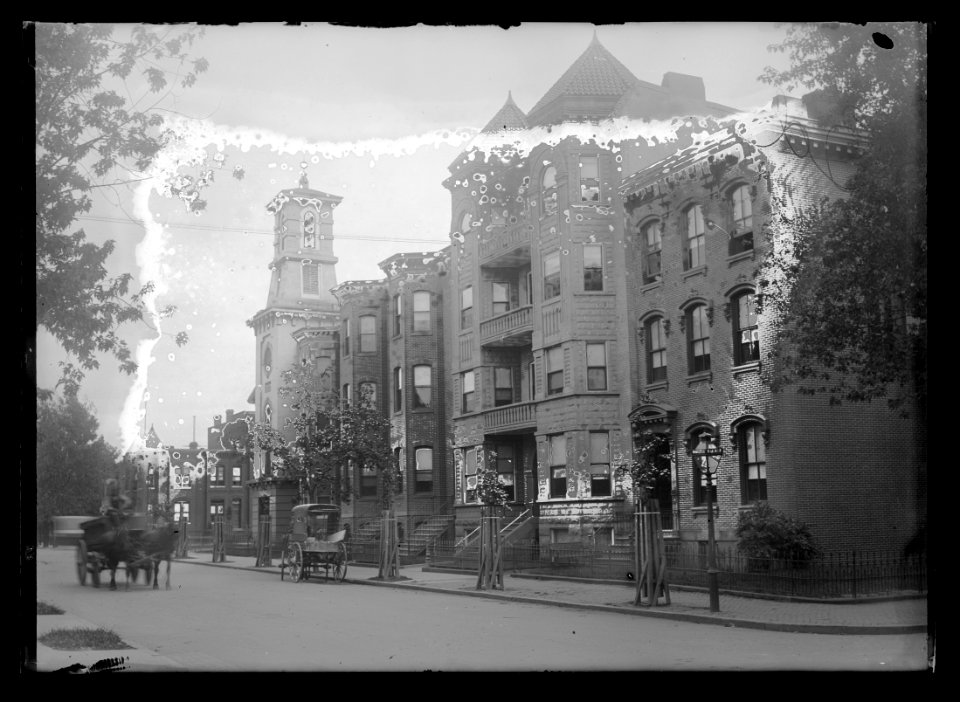 View of I Street, N.W., South side, looking East from 6th Street with the Cambridge Apartments on the same block with Assembly's Presbyterian Church, the white building LCCN2016646880