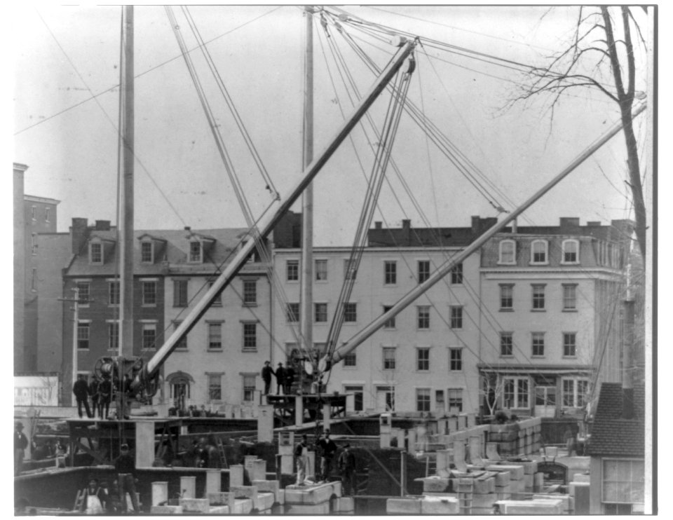 View of row houses looking across construction of State, War, and Navy building; Washington D.C. LCCN2016651065