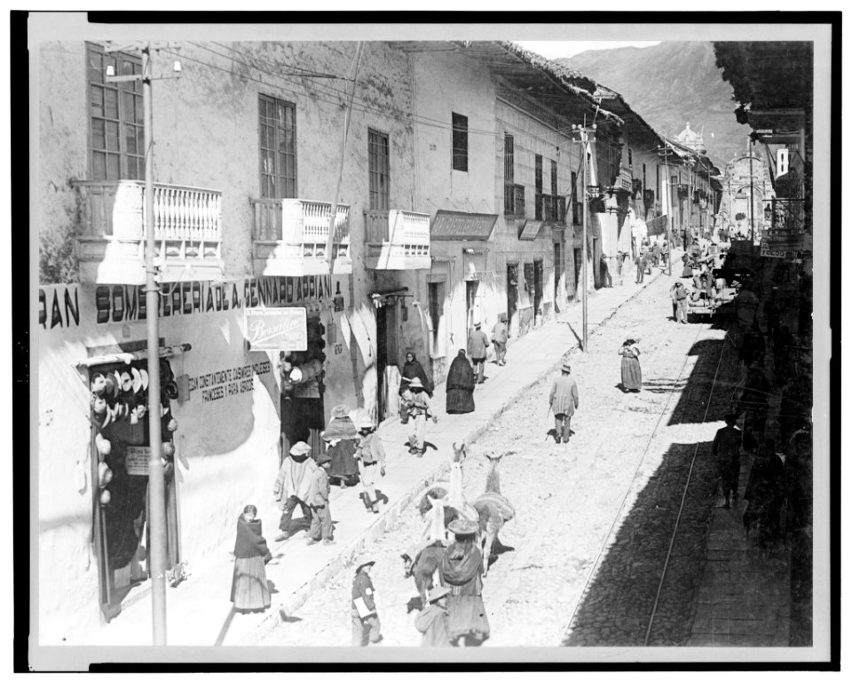 View of the Calle del Marquez, Cuzco, Peru, showing busy street scene with people and llamas LCCN2003675591