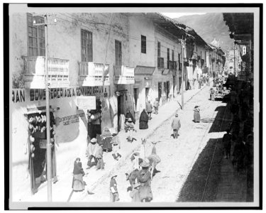View of the Calle del Marquez, Cuzco, Peru, showing busy street scene with people and llamas LCCN2003675591