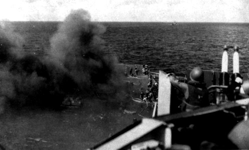 View of the forward flight deck aboard USS Ticonderoga (CV-14) after a kamikaze hit, 21 January 1945