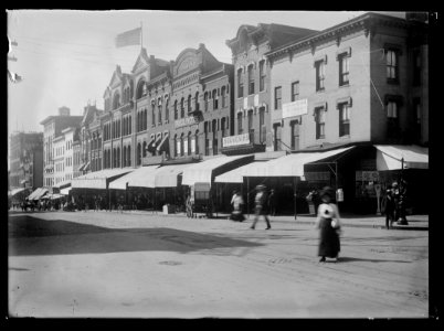 View of various stores and shops on 7th Street, N.W., West side, looking South from E Street LCCN2016646096