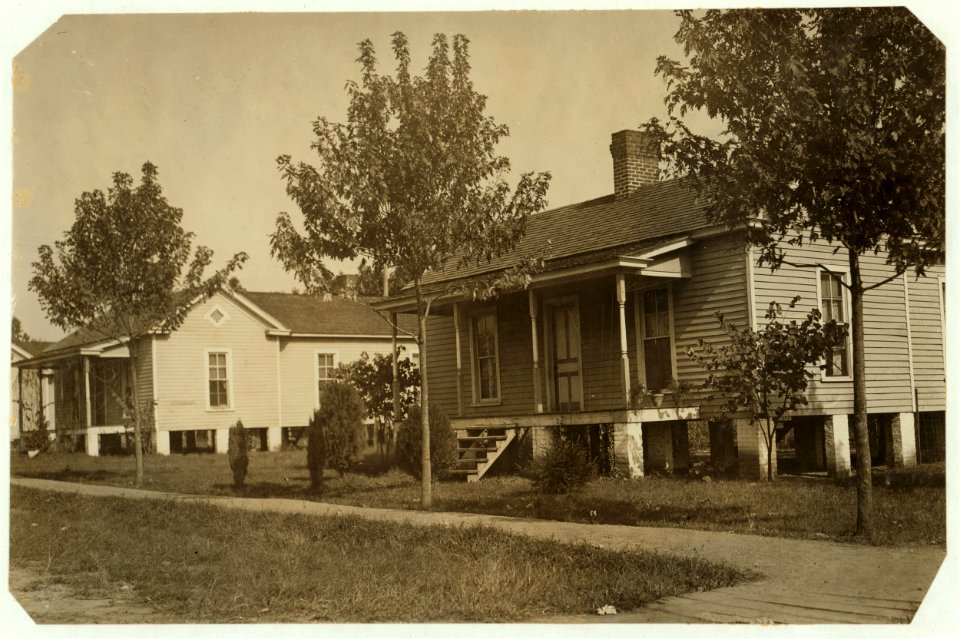 Views of the White Oak Cotton Mills, Greensboro, N.C., showing the beautiful location of the mill, its well-kept grounds, and the good housing conditions. LOC nclc.02676