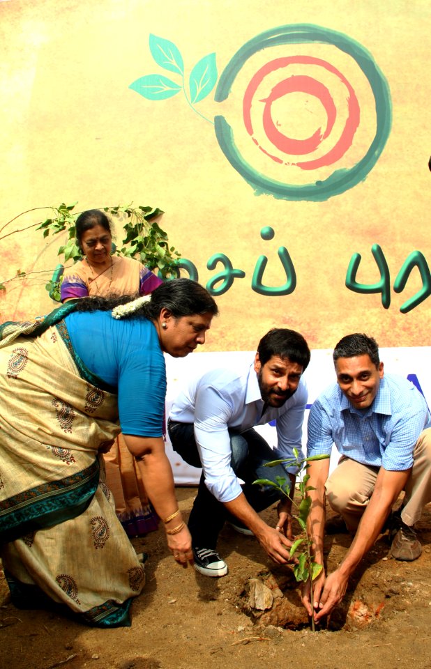 Vikram and Information Officer Anand Krishna plant a sapling at the YMCA grounds 1