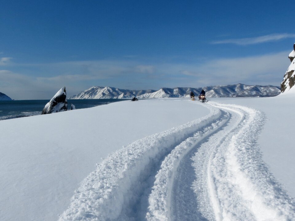 Coast snowmobiles tourists