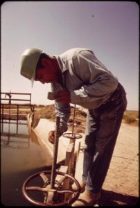 Vincent-humeumptewa-hopi-indian-and-employee-of-the-irrigation-district-opens-canal-gates-near-parker-may-1972 7152714867 o