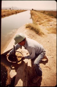 Vincent-humeumptewa-hopi-indian-and-employee-of-the-irrigation-district-opens-canal-gates-near-parker-may-1972 7152704283 o