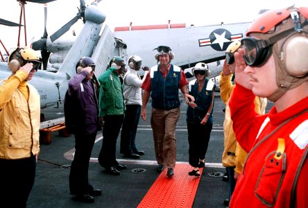 Virginia Governor George Allen and his wife Susan are piped through the ceremonial sideboys on board the Navys nuclear powered aircraft carrier USS GEROGE WASHINGTON (CVN 73)