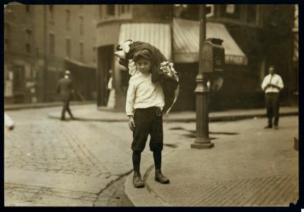 Vitto Romano, 76 Charter Street, Boston, Mass., carrying load of garments from 30 Blackstone Street. Said 12 years old and that only his mother finishes them. LOC nclc.04241