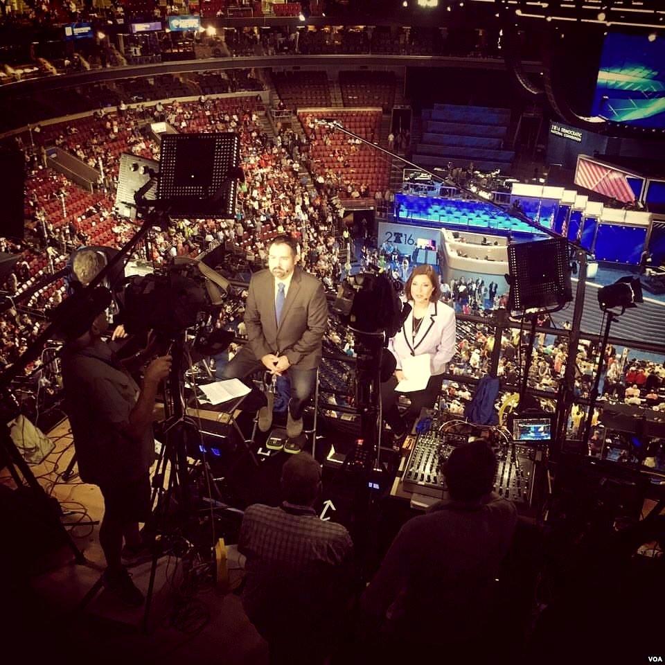 VOA Serbian's Bratislav Djordjevic (L) and VOA Spanish's Lina Correa (R) reporting from the DNC (1)