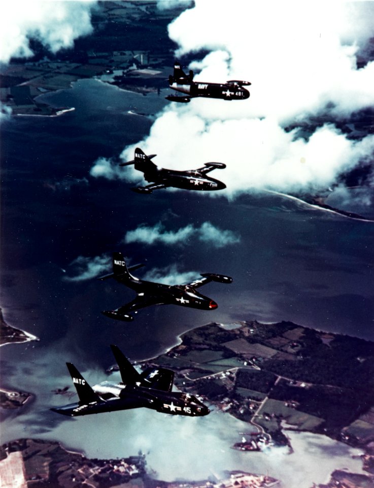 Vought F7U-1, McDonnell F2H-2, Grumman F9F-2 and Vought F6U-1 flying in formation, circa 1950 (NH 101815-KN)