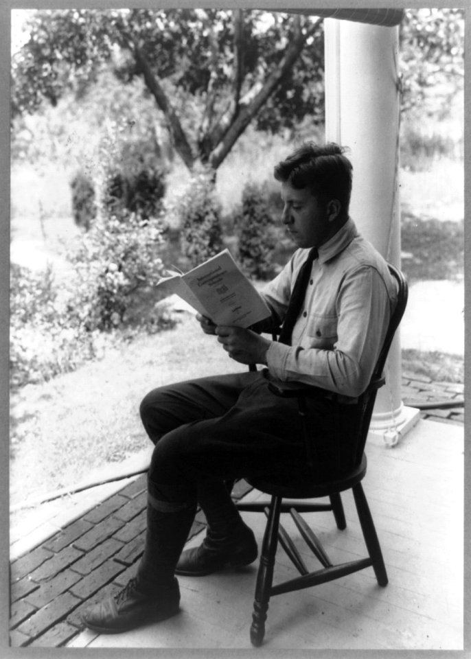 W. A. Rockefeller, full-length portrait, seated, facing left, reading International Correspondence Course text book LCCN93511328