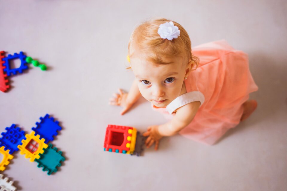 Little girl little ones child playing