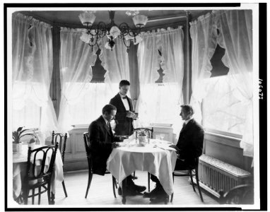 Waiter taking an order from two men in restaurant LCCN92515990 photo