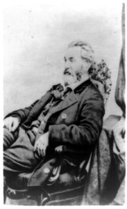 Walt Whitman, three-quarter length portrait, seated, facing left LCCN97504755 photo
