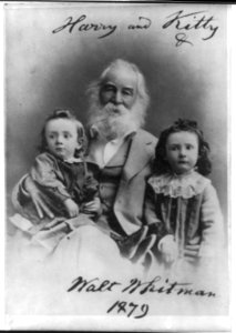 Walt Whitman, 1819-1892, seated portrait, facing left, with Harry & Kitty, children of J. N. Johnston LCCN2005688158