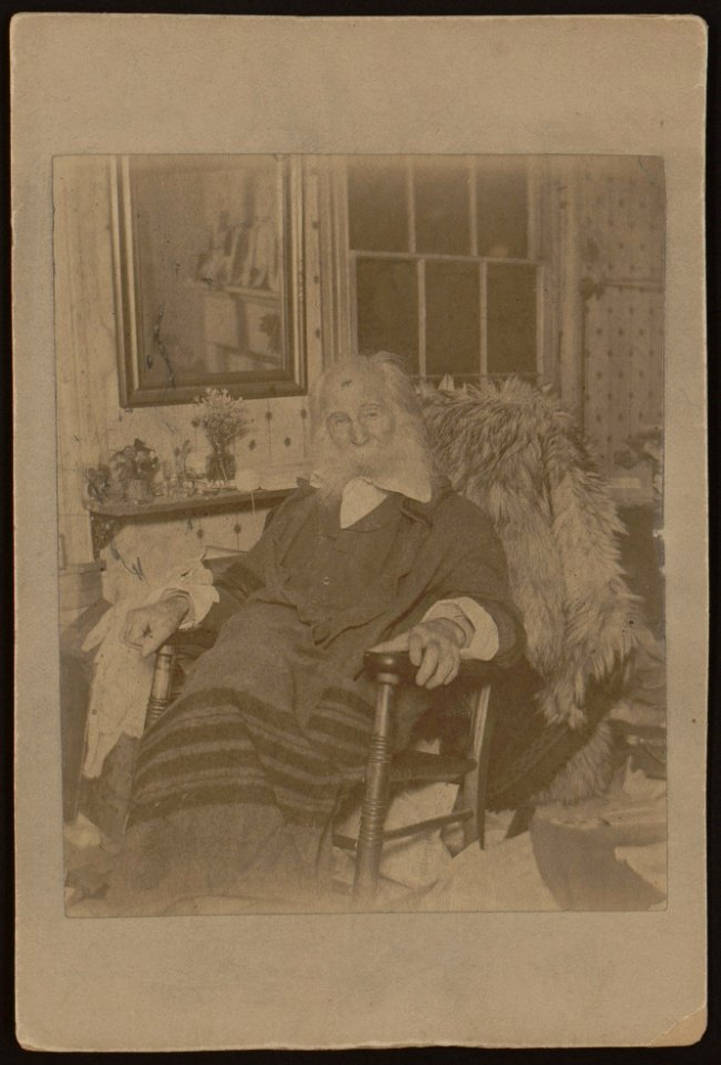 Walt Whitman, as an elderly man, full-length portrait, seated in rocking chair, facing front LCCN2005677241