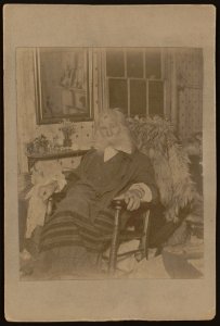Walt Whitman, as an elderly man, full-length portrait, seated in rocking chair, facing front LCCN2005677241