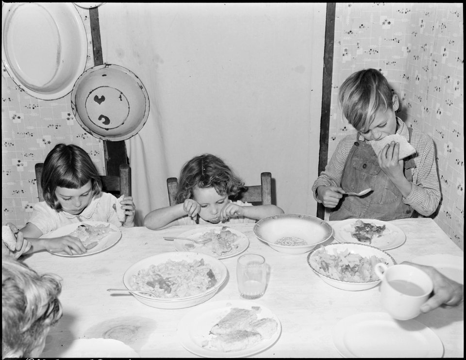 Wanda Lee, Bobbie Jean, and Donald Sergent, children of Blaine Sergent, coal loader, eating lunch. P V & K Coal... - NARA - 541310