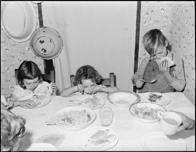 Wanda Lee, Bobbie Jean, and Donald Sergent, children of Blaine Sergent, coal loader, eating lunch. P V & K Coal... - NARA - 541310
