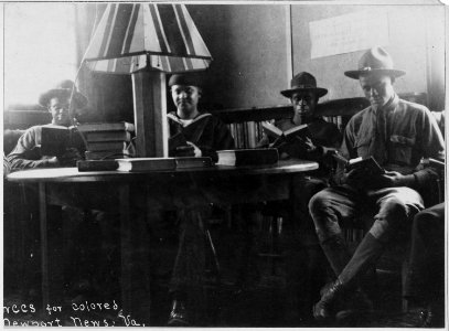 War Camp Community Service. Newport News. Four soldiers seated. American Library Association. Bo . . . - NARA - 533562